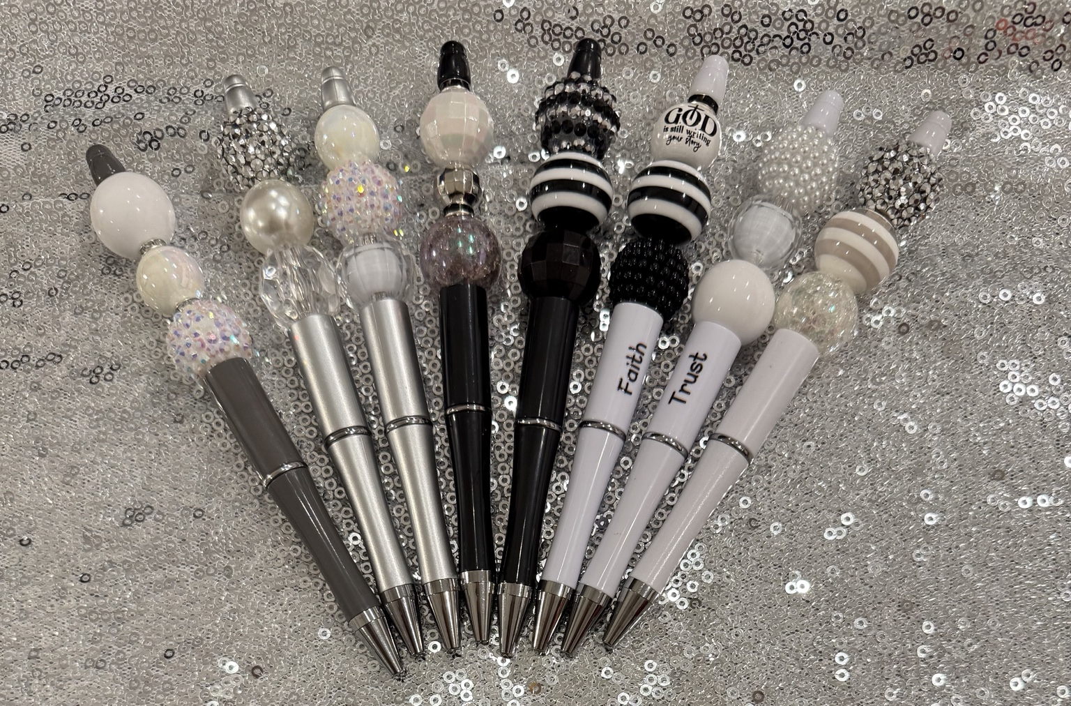 Complete collection of black, white, and silver handmade beaded pens